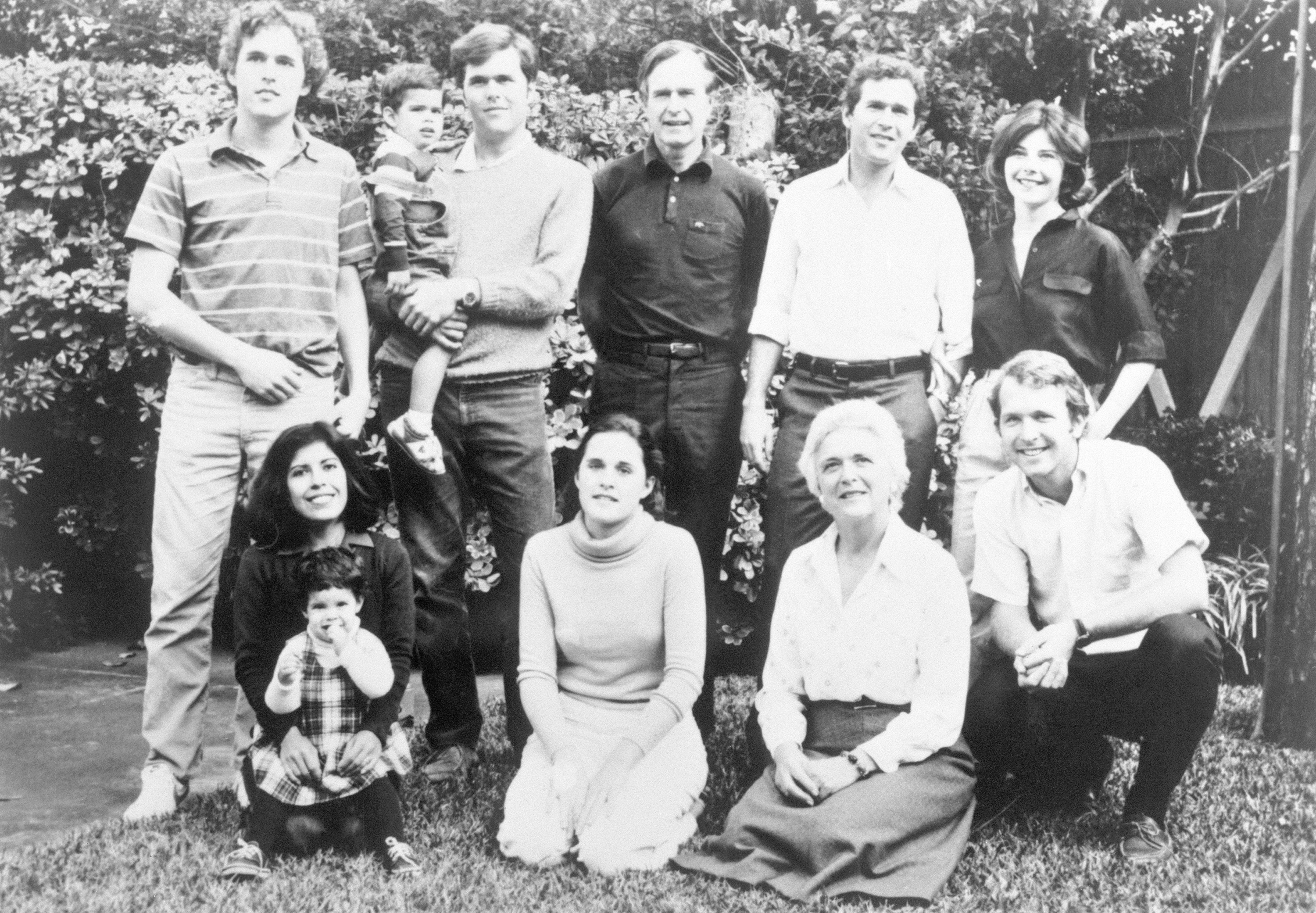Slide 7 of 28: (Original Caption) Bush Family Photo. Top, Left to right: Marvin, 22; George, 3; Jeb, 26; George; George W., 33; George's wife, Laura. Bottom, left to right: Jeb's wife, Columba; Noelle, 2; Dorothy, 20; Barbara; Neil, 24.