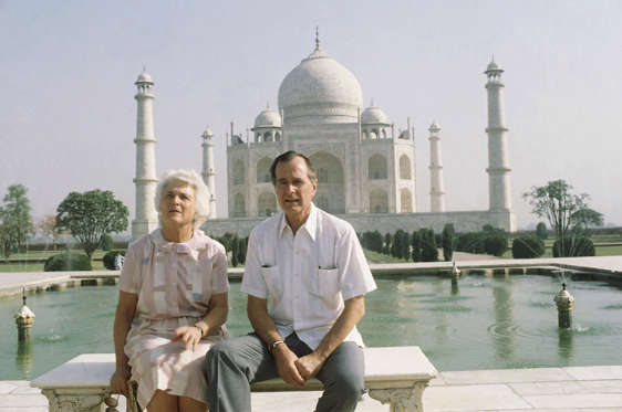 Slide 9 of 28: U.S. Vice President George H. W. Bush, right, and his wife Barbara Bush pose in front of the Taj Mahal, the 17th century monument to love was built by a Mughal Emperor Sahajahan in memory of his beloved queen who bore 14 children, Saturday, May 13, 1984, Agra, India.