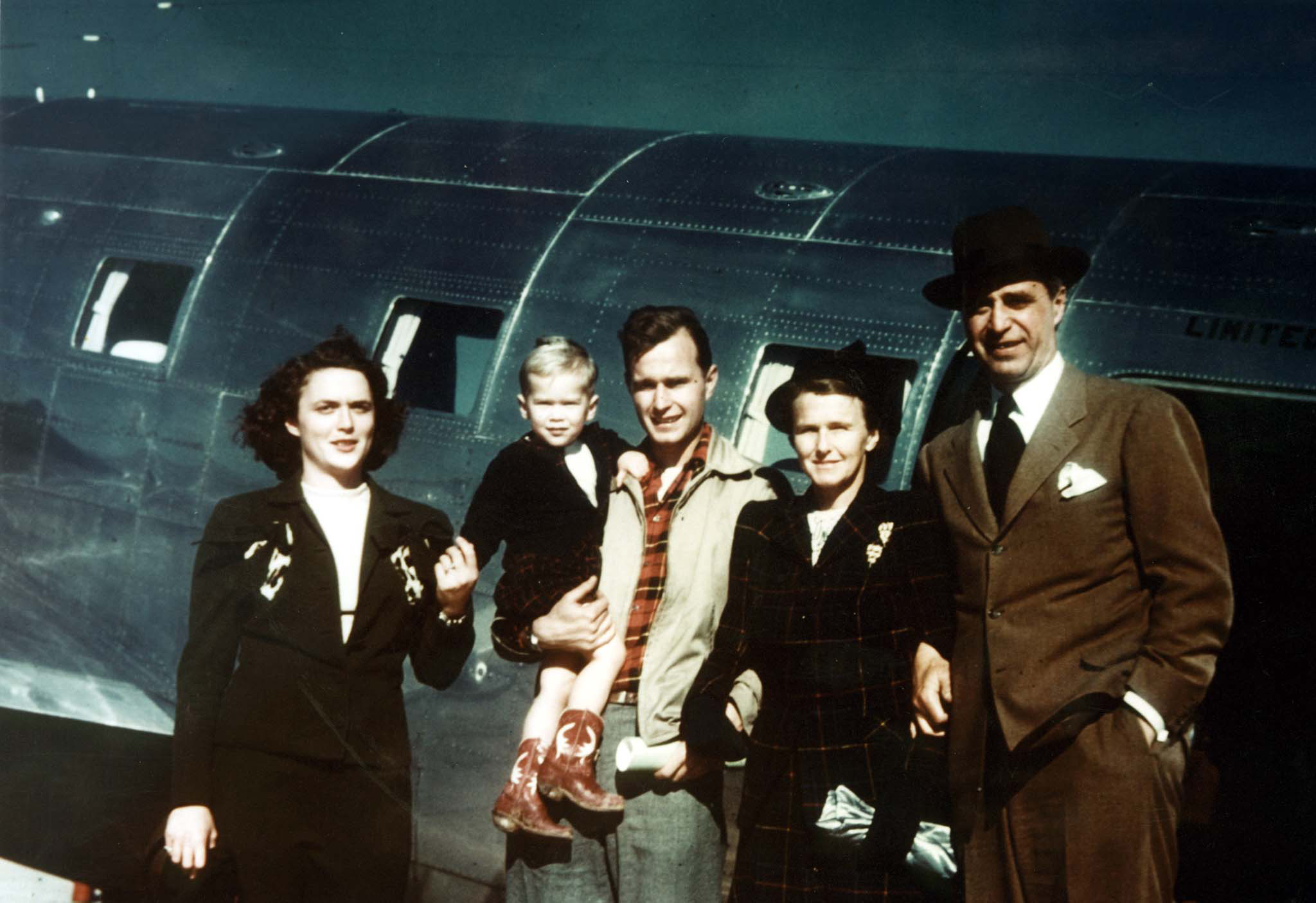 Slide 2 of 28: George W. Bush with his mother Barbara Bush, father, George Bush, and grandparents, Prescott and Dorothy Bush in Midland, Texas.