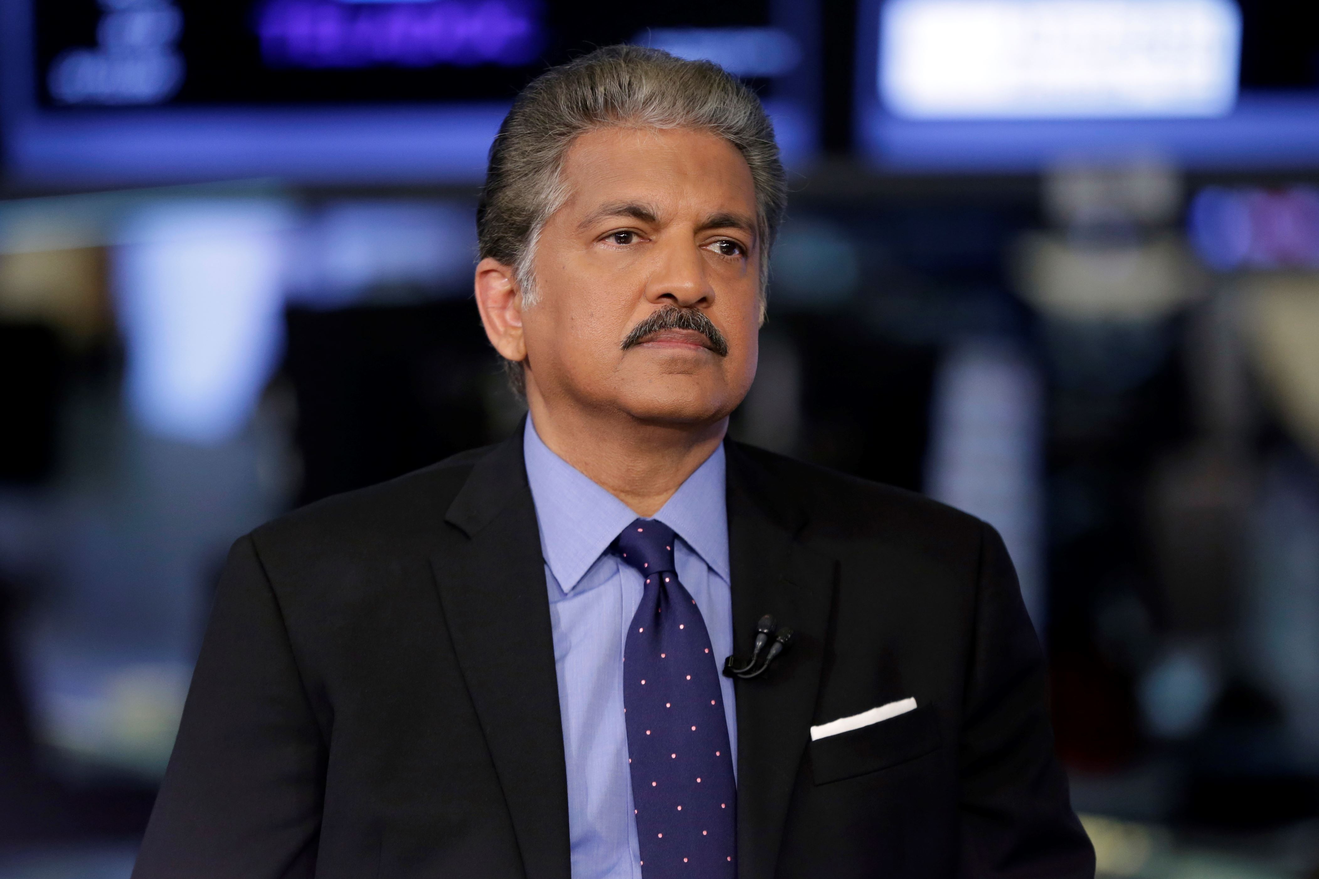 Anand Mahindra, chairman of the Mahindra Group, is interviewed on the floor of the New York Stock Exchange, Tuesday, July 18, 2017. (AP Photo/Richard Drew)