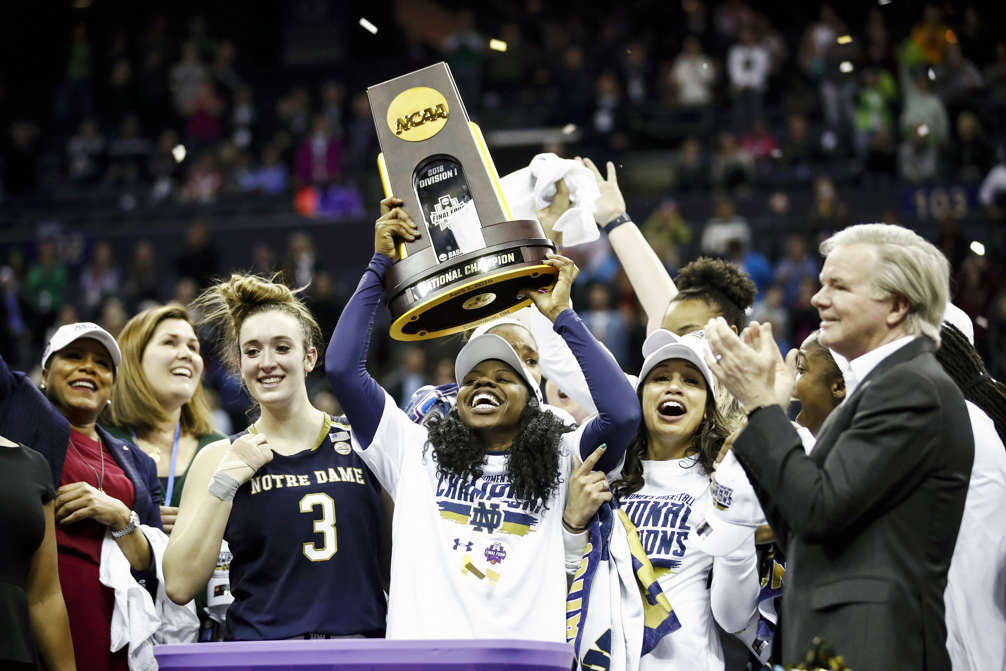 Slide 1 of 97: Arike Ogunbowale (24) of Notre Dame hoist the NCAA championship trophy after scoring the game winning basket to defeat Mississippi State in the championship game of the 2018 NCAA Women's Final Four on April 1, in Columbus, Ohio. The Fighting Irish defeated the Lady Bulldogs 61-58.