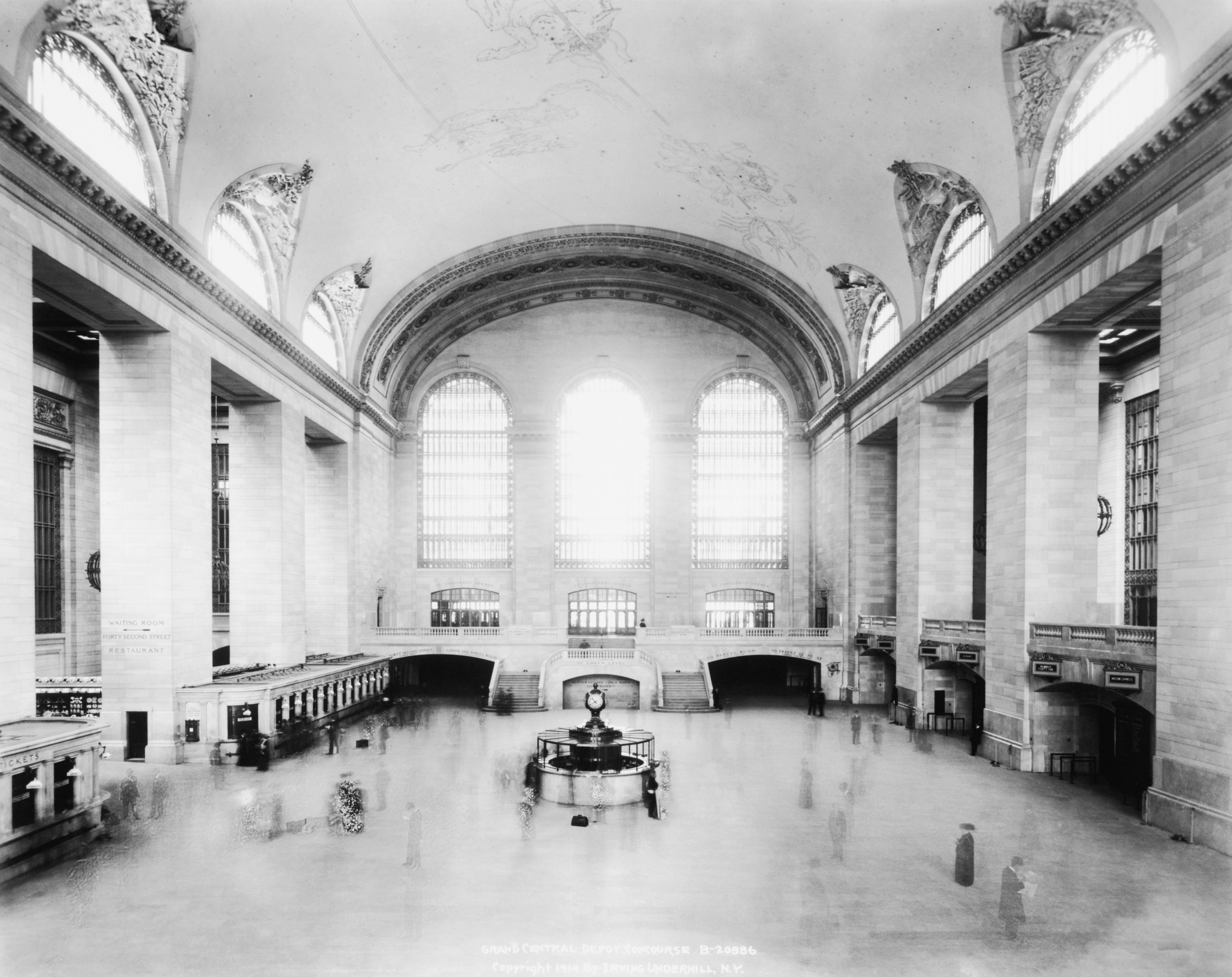 Slide 18 of 29: Interior of Grand Central train station, showing a nearly empty concourse area.