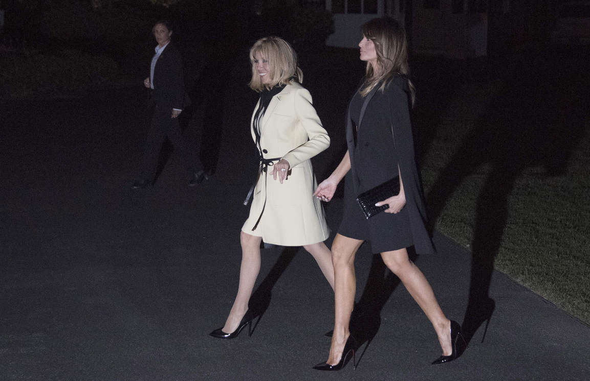 Slide 29 of 29: US First Lady Melania Trump escorts Brigitte Macron, wife of French President Emmanuel Macron, upon their return to the White House in Washington, DC, on April 23, 2018.