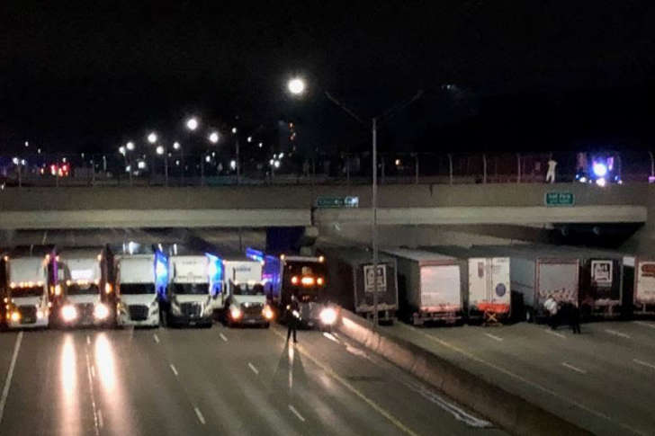 Semi trucks block a suicide attempt in Detroit early Tuesday morning on April 24, 2018.