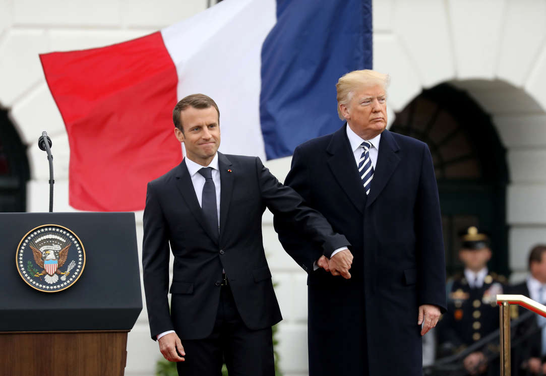 Slide 4 of 29: US President Donald Trump and French President Emmanuel Macron shake hands during a state welcome at the White House in Washington, DC, on April 24, 2018.