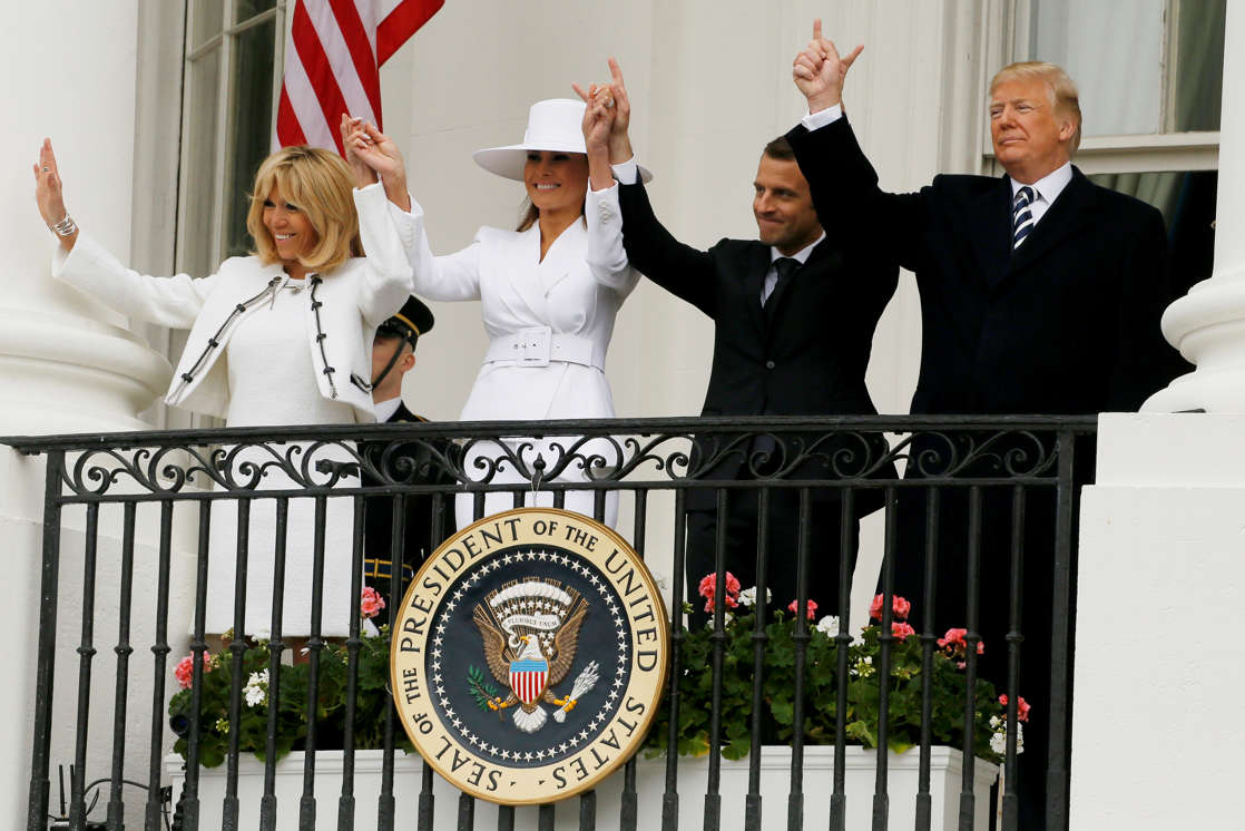 Slide 2 of 29: U.S. President Donald Trump, first lady Melania Trump and French President Emmanuel Macron and his wife Brigitte Macron gesture during an arrival ceremony at the White House in Washington, U.S., April 24, 2018.