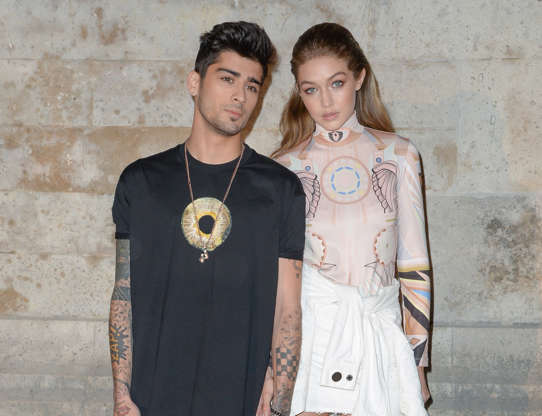 Slide 4 of 25: PARIS, FRANCE - OCTOBER 02: Zayn Malik and Gigi Hadid attend the Givenchy show as part of the Paris Fashion Week Womenswear Spring/Summer 2017on October 2, 2016 in Paris, France. (Photo by Stephane Cardinale - Corbis/Corbis via Getty Images)