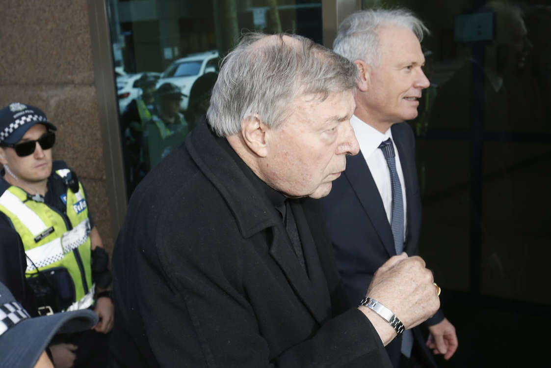 MELBOURNE, AUSTRALIA - JULY 26:  Cardinal Pell walks with a heavy Police guard to the Melbourne Magistrates' Court on July 26, 2017 in Melbourne, Australia. Cardinal Pell was charged on summons by Victoria Police on 29 June over multiple allegations of sexual assault. Cardinal Pell is Australia's highest ranking Catholic and the third most senior Catholic at the Vatican, where he was responsible for the church's finances. Cardinal Pell has leave from his Vatican position while he defends the charges.  (Photo by Darrian Traynor/Getty Images)