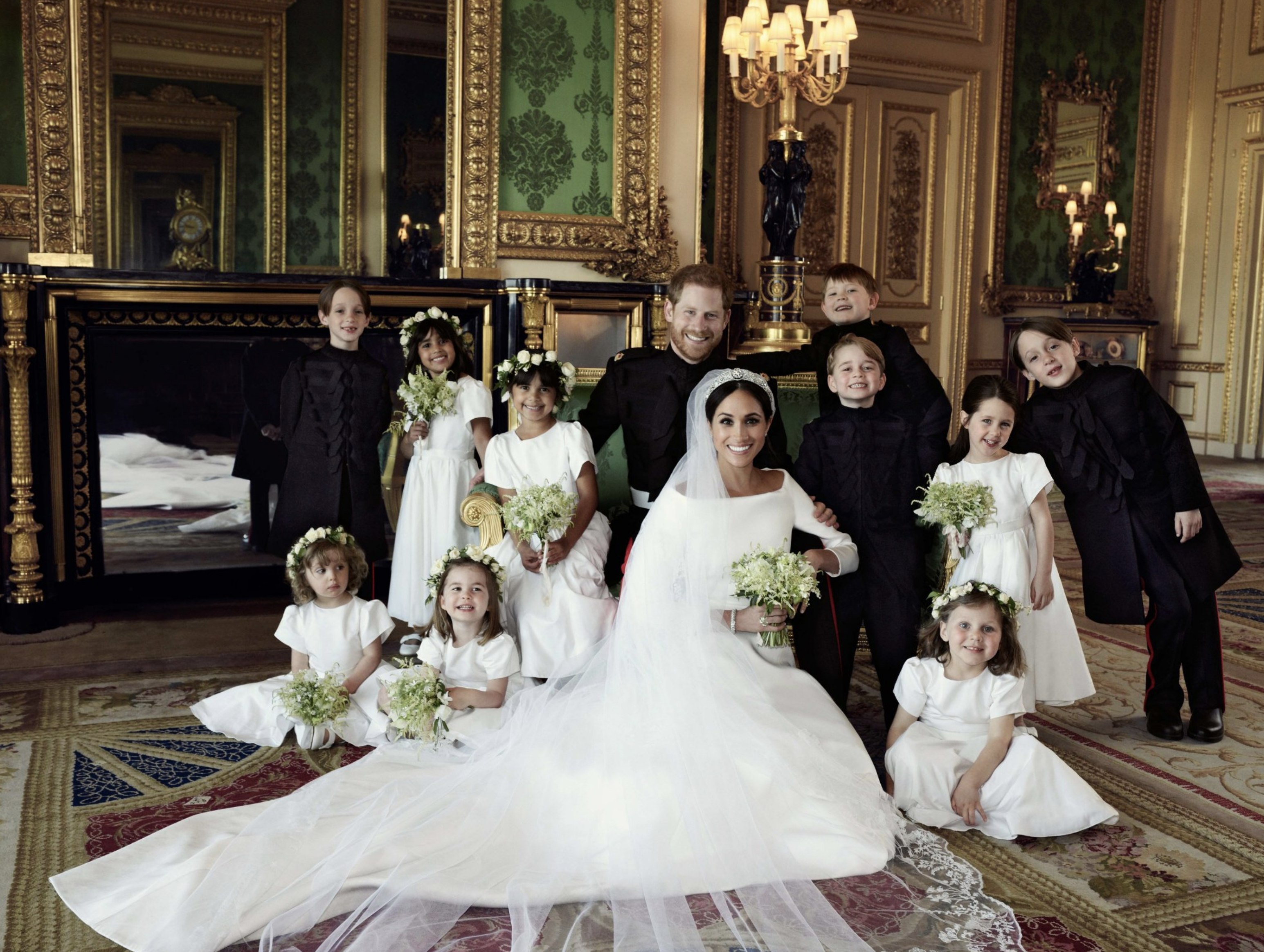 Slide 3 of 56: "The Duke and Duchess of Sussex are surrounded by their Bridesmaids and Pageboys in The Green Drawing Room of Windsor Castle. #RoyalWedding" --The Royal Family Twitter account, which shared this official wedding photo of Prince Harry and Meghan Markle with their young attendants