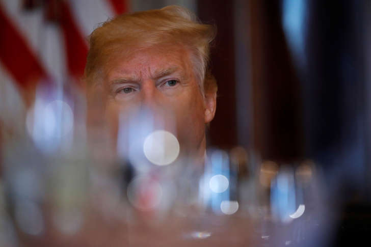 U.S. President Donald Trump attends a dinner with governors on border security and safe communities at the Blue room of the White House in Washington, U.S., May 21, 2018.