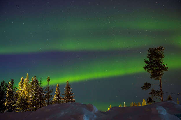 Slide 1 of 35: SWEDEN - 2018/03/15: An aurora sometimes referred to as polar lights, northern lights (aurora borealis) is produced when the magnetosphere is sufficiently disturbed by the solar wind that the trajectories of charged particles in both solar wind and magnetospheric plasma, mainly in the form of electrons and protons, precipitate them into the upper atmosphere here at the Icehotel in Jukkasjarvi near Kiruna in Swedish Lapland; northern Sweden. (Photo by Wolfgang Kaehler/LightRocket via Getty Images)