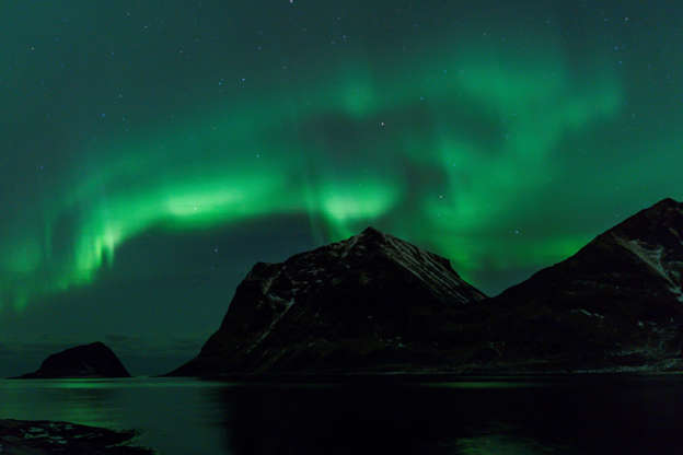 Slide 2 of 35: Northern Lights are pictured on March 9, 2018, in Utakleiv, northern Norway, Lofoten islands, within the Arctic Circle. / AFP PHOTO / OLIVIER MORIN (Photo credit should read OLIVIER MORIN/AFP/Getty Images)