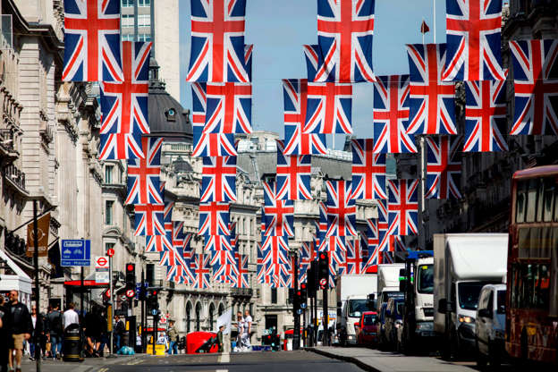 Slide 12 of 27: Union flag decorations are seen in Regent Street, London on May 11, 2018 ahead of the Royal Wedding of Prince Harry and US actress Meghan Markle. - Britain's Prince Harry and US actress Meghan Markle will marry on May 19 at St George's Chapel in Windsor Castle. (Photo by Tolga AKMEN / AFP)        (Photo credit should read TOLGA AKMEN/AFP/Getty Images)