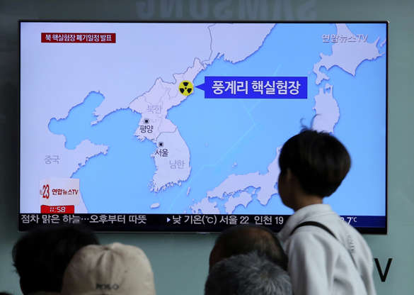 Slide 4 of 138: People watch a TV screen reporting that North Korea will dismantle nuke test site during a news program at the Seoul Railway Station in Seoul, South Korea, Sunday, May 13, 2018. North Korea said Saturday that it will dismantle its nuclear test site in less than two weeks, in a dramatic event that would set up leader Kim Jong Un's summit with President Donald Trump next month. Trump welcomed the "gracious gesture." The signs read: " Punggye-ri nuclear test." (AP Photo/Ahn Young-joon)
