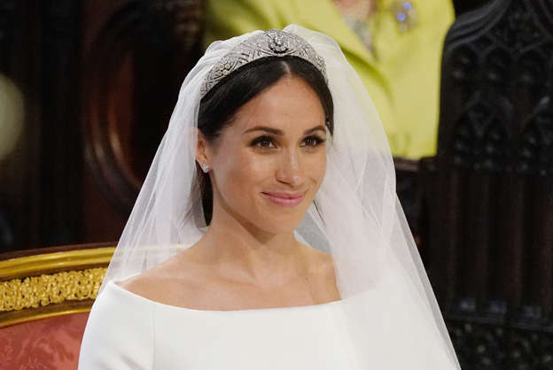 CAPTION: US fiancee of Britain's Prince Harry, Meghan Markle arrives at the High Altar for their wedding ceremony in St George's Chapel, Windsor Castle, in Windsor, on May 19, 2018. (Photo by Jonathan Brady / POOL / AFP) (Photo credit should read JONATHAN BRADY/AFP/Getty Images)