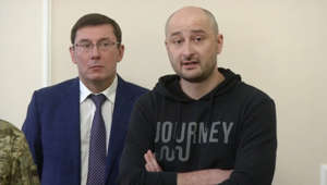 a man wearing a suit and tie: Russian journalist Babchenko turns up alive after reported murder