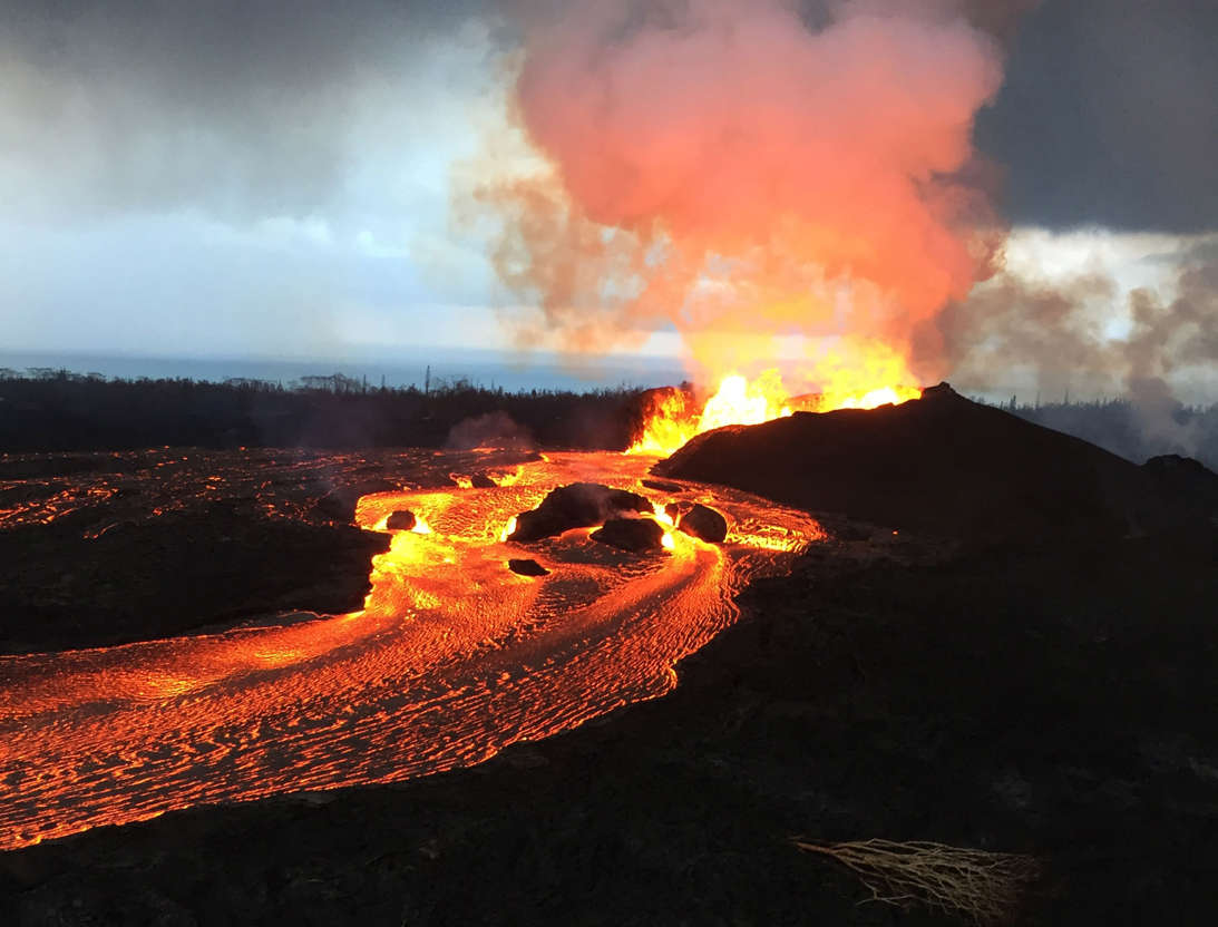 Slide 2 of 100: HANDOUT EDITORIAL USE ONLY/NO SALES Mandatory Credit: Photo by USGS HANDOUT/EPA-EFE/REX/Shutterstock (9715243b) A handout photo made available by the United States Geological Survey (USGS) on 13 June 2018 shows Kilauea volcano's Fissure 8 fountains that reportedly reached heights up to 160 feet (48 meters) overnight, Hawaii, USA, 12 June 2108. Lava fragments falling from the fountains are building a cinder-and-spatter cone around the vent, with the highest part of the cone (about 125 feet high, 38 meters high) on the downwind side. Hawaii's Kilauea volcanic activity, USA - 12 Jun 2018