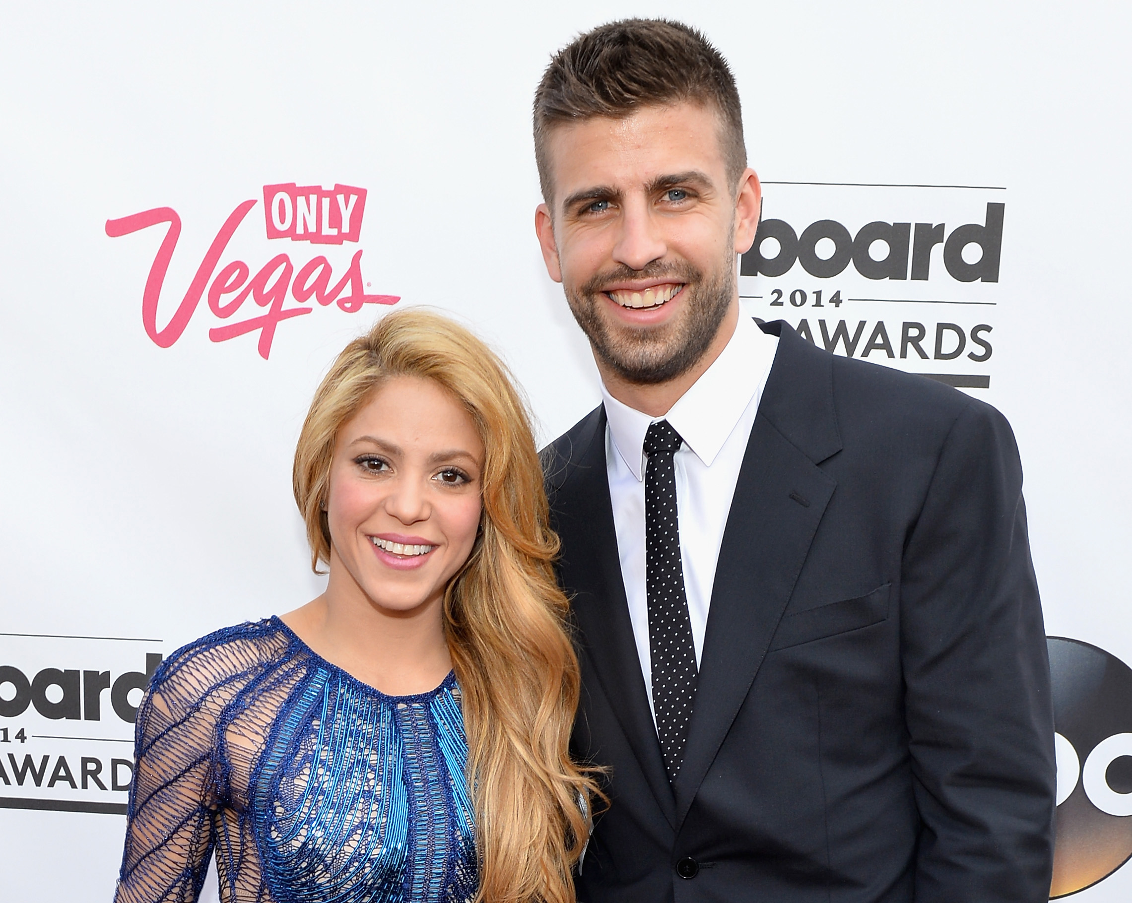 Slide 1 of 21: LAS VEGAS, NV - MAY 18: Singer-songwriter Shakira (L) and professional soccer player Gerard Pique attend the 2014 Billboard Music Awards at the MGM Grand Garden Arena on May 18, 2014 in Las Vegas, Nevada. (Photo by Bryan Steffy/Billboard Awards 2014/Getty Images for DCP)