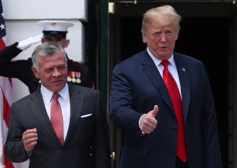 U.S. President Donald Trump welcomes Jordanâ€™s King Abdullah as he arrives at the White House in Washington, U.S., June 25, 2018. REUTERS/Jonathan Ernst