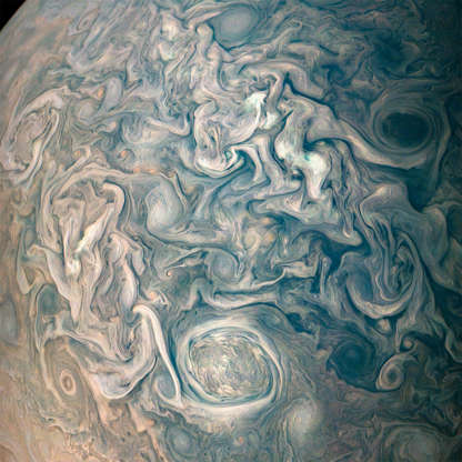 Slide 4 de 25: NASA’s Juno spacecraft took this color-enhanced image at 10:23 p.m. PDT on May 23, 2018 (1:23 a.m. EDT on May 24), as the spacecraft performed its 13th close flyby of Jupiter. At the time, Juno was about 9,600 miles (15,500 kilometers) from the planet's cloud tops, above a northern latitude of 56 degrees.