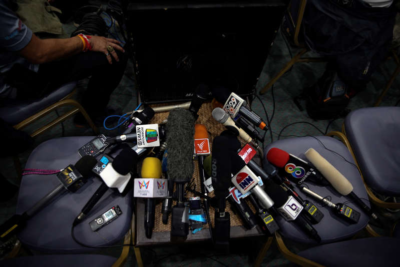 Microphones belonging to media organizations are pictured during a news conference at the Chiang Rai Prachanukroh hospital, in Chiang Rai, Thailand, July 10, 2018. REUTERS/Athit Perawongmetha