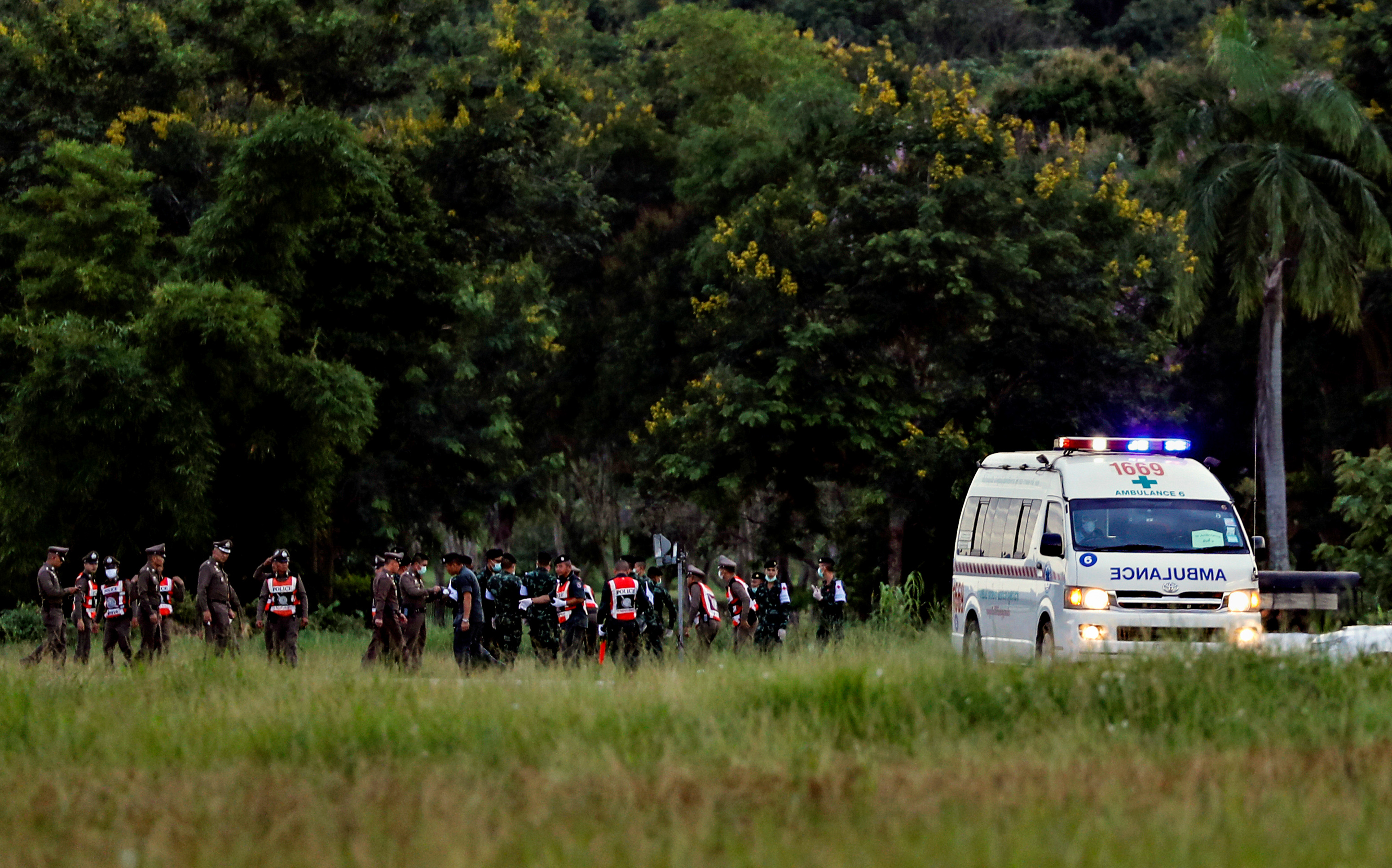 Slide 1 of 84: An ambulance carrying rescued schoolboys leaves a military airport in Chiang Rai, Thailand, July 10, 2018.