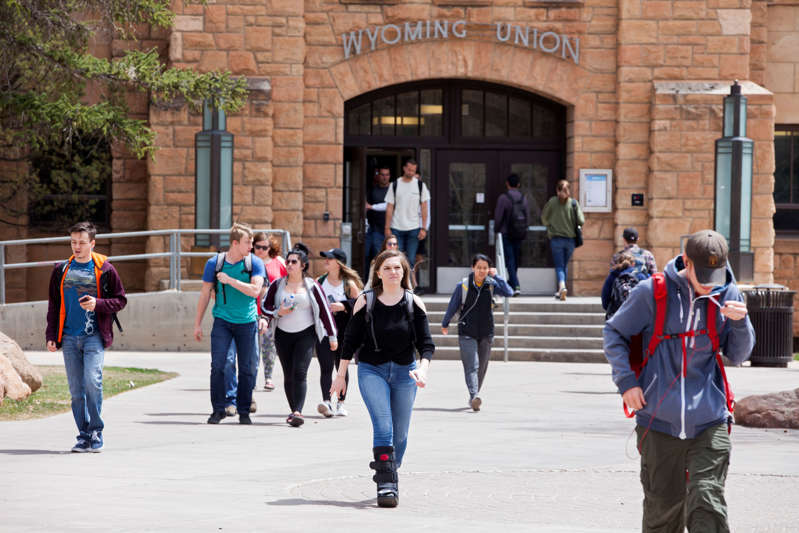 LARAMIE, WY - APRIL 30: Students walk across campus between classes at the University of Wyoming, on April 30, 2018 in Laramie, Wyoming. UW is a land-grant university, founded in March 1886 and opened in September 1887. The University of Wyoming is unusual in that its location within the state is written into the state's constitution. (Photo by Melanie Stetson Freeman/The Christian Science Monitor via Getty Images)