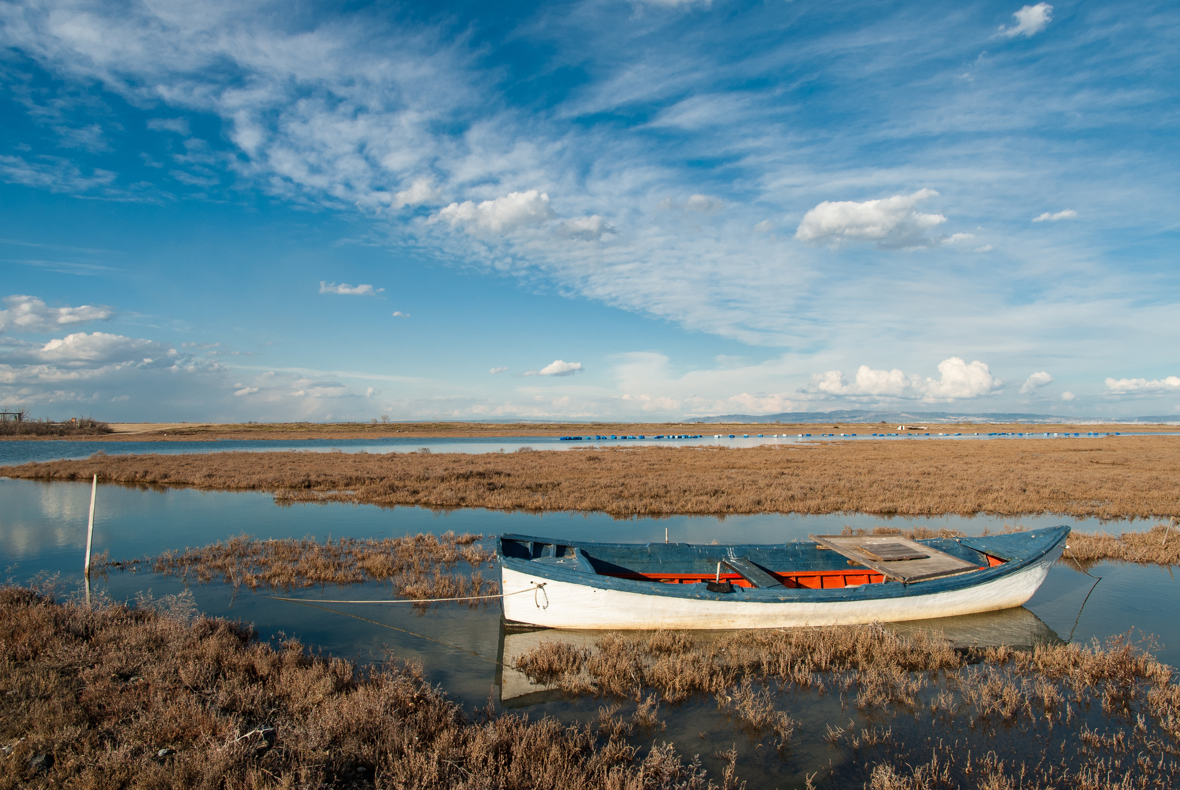 ÎÎ¹Î±ÏÎ¬Î½ÎµÎ¹Î± 18 Î±ÏÏ 35: Landscape with traditional wooden boat in Axios Delta, near Thessaloniki, Greece. Axios or Vardar is the second largest river in the Balkans.