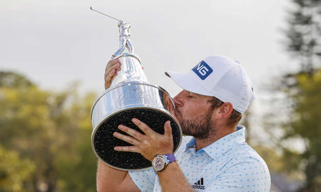 Slide 1 of 84: ORLANDO, FLORIDA - MARCH 08: Tyrrell Hatton of England celebrates with the trophy after winning during the final round of the Arnold Palmer Invitational Presented by MasterCard at the Bay Hill Club and Lodge on March 08, 2020 in Orlando, Florida. (Photo by Kevin C. Cox/Getty Images)