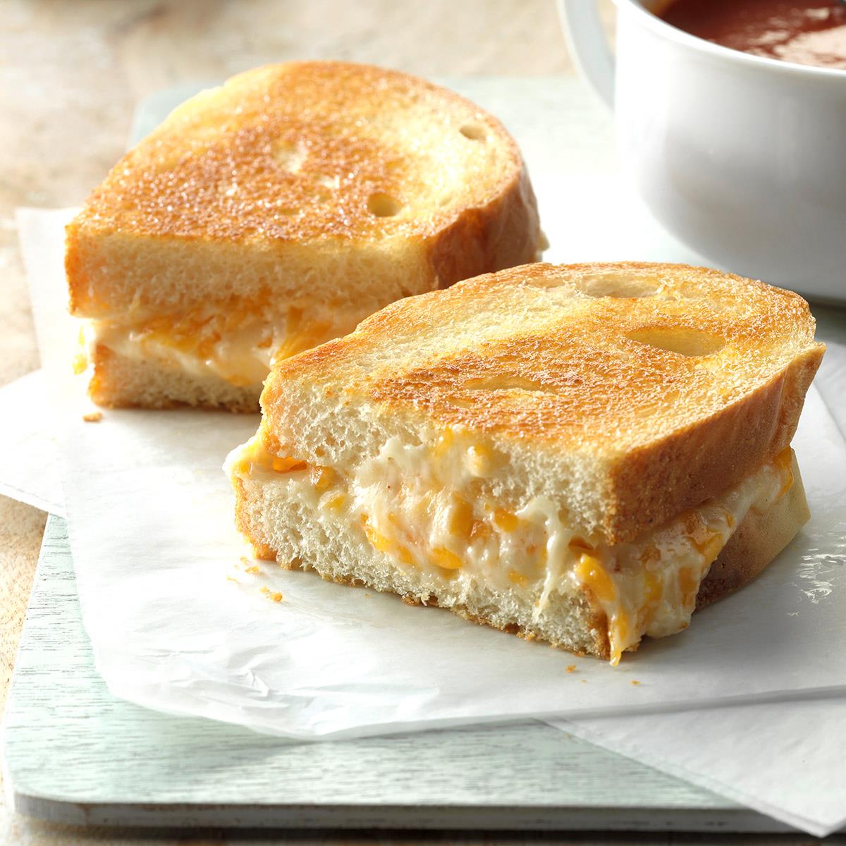These gooey grilled cheese sandwiches taste great for lunch with sliced apples. And they're really fast to whip up, too. Here's how to make grilled cheese the right way. —Kathy Norris, Streator, Illinois <a href="https://www.tasteofhome.com/recipes/the-ultimate-grilled-cheese/">Get Recipe</a>