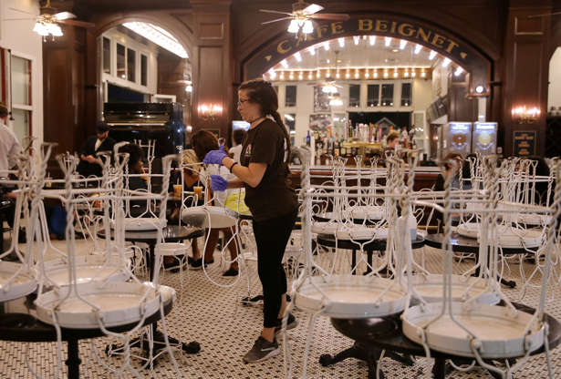 Slide 4 of 154: Angelina Deroche closes a restaurant early due to coronavirus (COVID-19) related restrictions in the French Quarter neighborhood of New Orleans, Louisiana, U.S. March 15, 2020. REUTERS/Jonathan Bachman