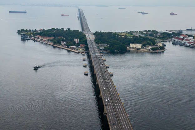 Slide 1 of 22: NITEROI, BRAZIL - MARCH 21:  An aerial view of a near empty Rio-Niteroi bridge that connects the cities of Niterói and Rio de Janeiro during Rio de Janeiros lock down aimed at stopping the spread of the coronavirus (COVID-19) pandemic on March 21, 2020 in Niteroi, Brazil. Rio de Janeiro's state government imposed restrictions to public transport. Bus lines and trains are closed, ferries and subway are running at a limited capacity. According to the Ministry of Health, as Friday, March 20, Brazil had 978 confirmed cases of coronavirus (COVID-19) and at least 11 recorded fatalities. (Photo by Buda Mendes/Getty Images)