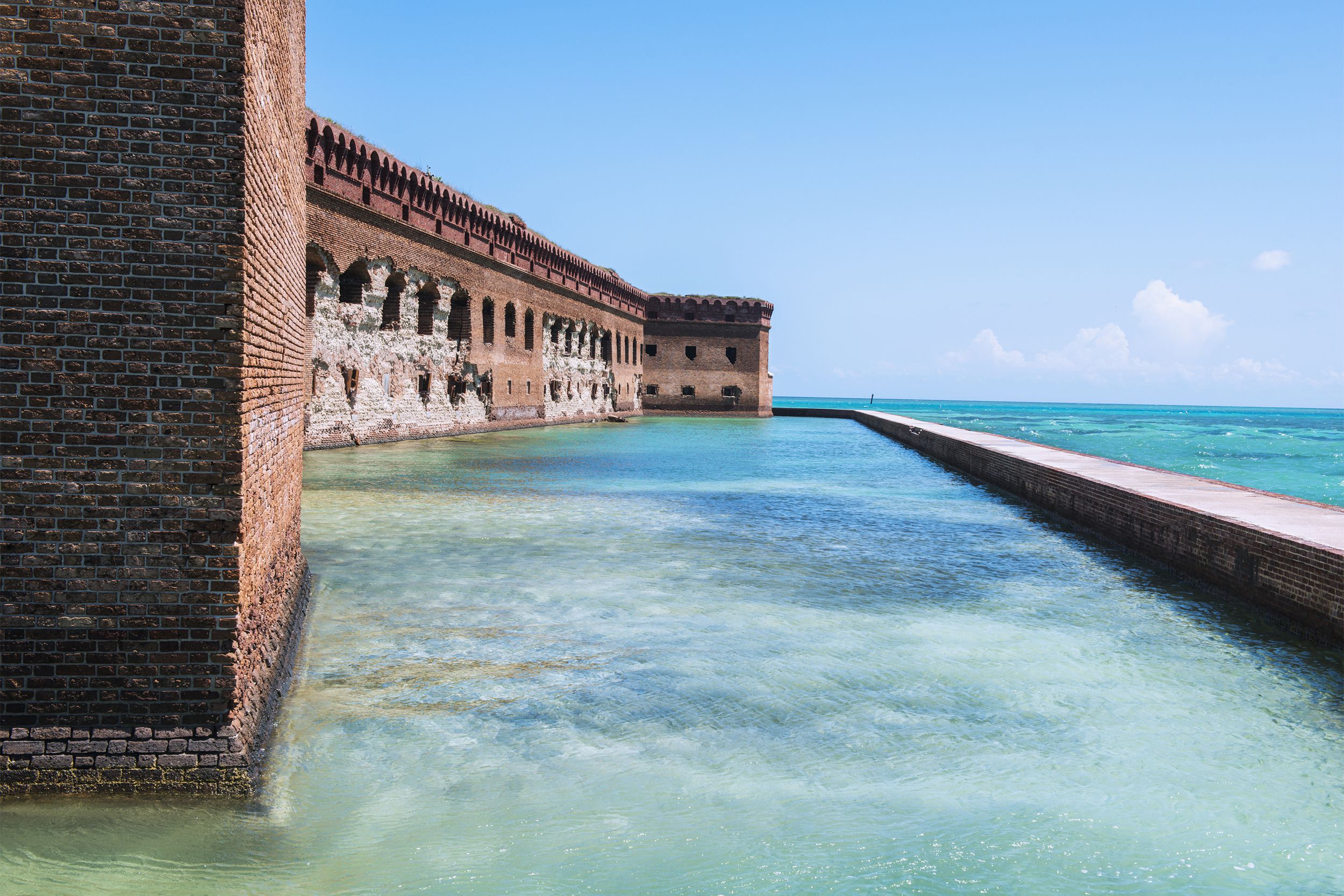 The remote <a href="https://www.nps.gov/drto/index.htm">Dry Tortugas National Park</a>, located about 70 miles west of Key West, is a 100-square mile park made up primarily of open water. There are also seven small islands. This park can only be explored by boat, or perhaps seaplane. Its highlights include Fort Jefferson, coral reefs, and a variety of bird life.