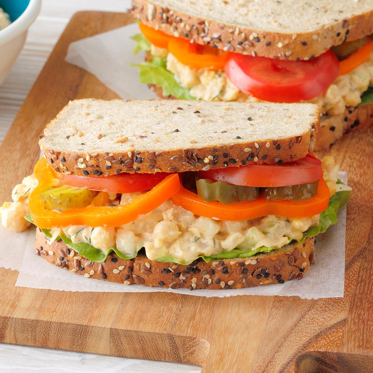These chickpea salad sandwiches are super flavorful and contain less fat and cholesterol than chicken salad. They make delightful picnic sandwiches. —Deanna McDonald, Muskegon, Michigan <a href="https://www.tasteofhome.com/recipes/dilly-chickpea-salad-sandwiches/">Get Recipe</a>