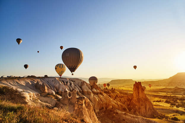 Slide 33 de 65: Hot Air Balloons Flying at Sunset, Cappadocia, Turkey