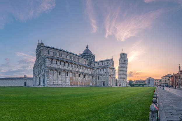 Slide 35 de 65: Italy, Tuscany, Pisa, View to Pisa Cathedral and Leaning Tower of Pisa from Piazza dei Miracoli at sunset
