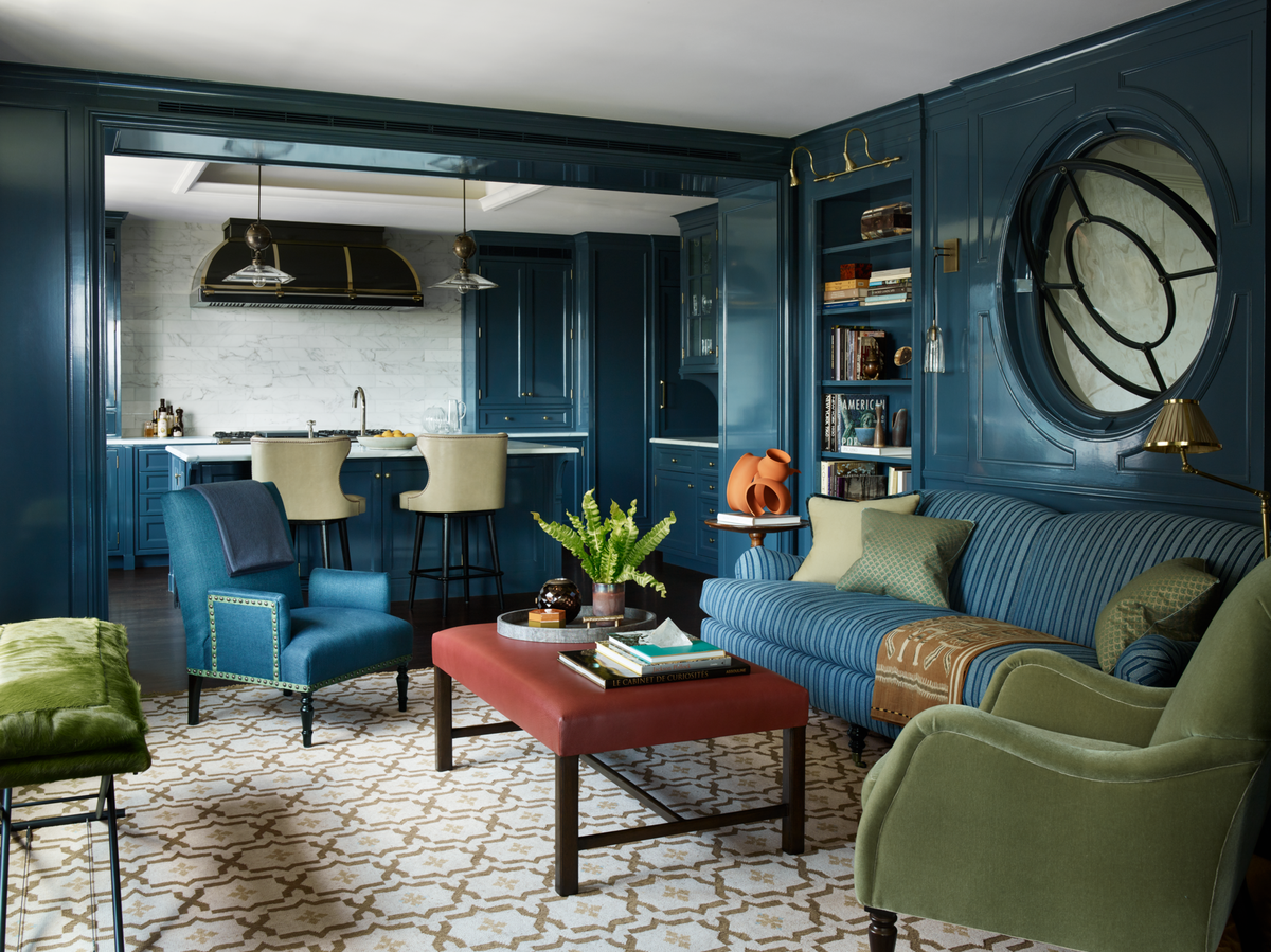 <p>Designer <a href="https://tammyconnorid.com/">Tammy Connor</a> connected the family room and kitchen of this New York City apartment by lacquering the walls in a rich ocean shade. The kitchen stools from <a href="https://www.soane.co.uk/">Soane Britain</a> are covered in a <a href="https://www.jerrypair.com/">Jerry Pair </a>fabric. Pendant lighting from <a href="https://www.balsamoantiques.com/inventory/lighting/pendants">Balsamo</a> lights up a <a href="https://www.frenchranges.com/">Lacanche</a> range. The <a href="https://fave.co/2HjjIUn">John Saladino</a> x-bench in a <a href="https://fave.co/2Hml4fQ">Kyle Bunting</a> hide seamlessly matches the <a href="https://fave.co/2VDM4l4">George Smith</a> armchair. The <a href="https://fave.co/2Yx4uRr">Ferrell Mittman</a> sofa is in a <a href="https://fave.co/2VCKwYC">Peter Dunham Textile</a> stripe, and the custom rug is from <a href="https://fave.co/2HnzZGB">Beauvais Carpets</a>. For a similar paint color, try Benjamin Moore’s Slate Teal in a pearl finish.<br><br><a class="body-btn-link" href="https://www.benjaminmoore.com/en-us/color-overview/find-your-color/color/2058-20/slate-teal?color=2058-20">Get the Look</a></p>