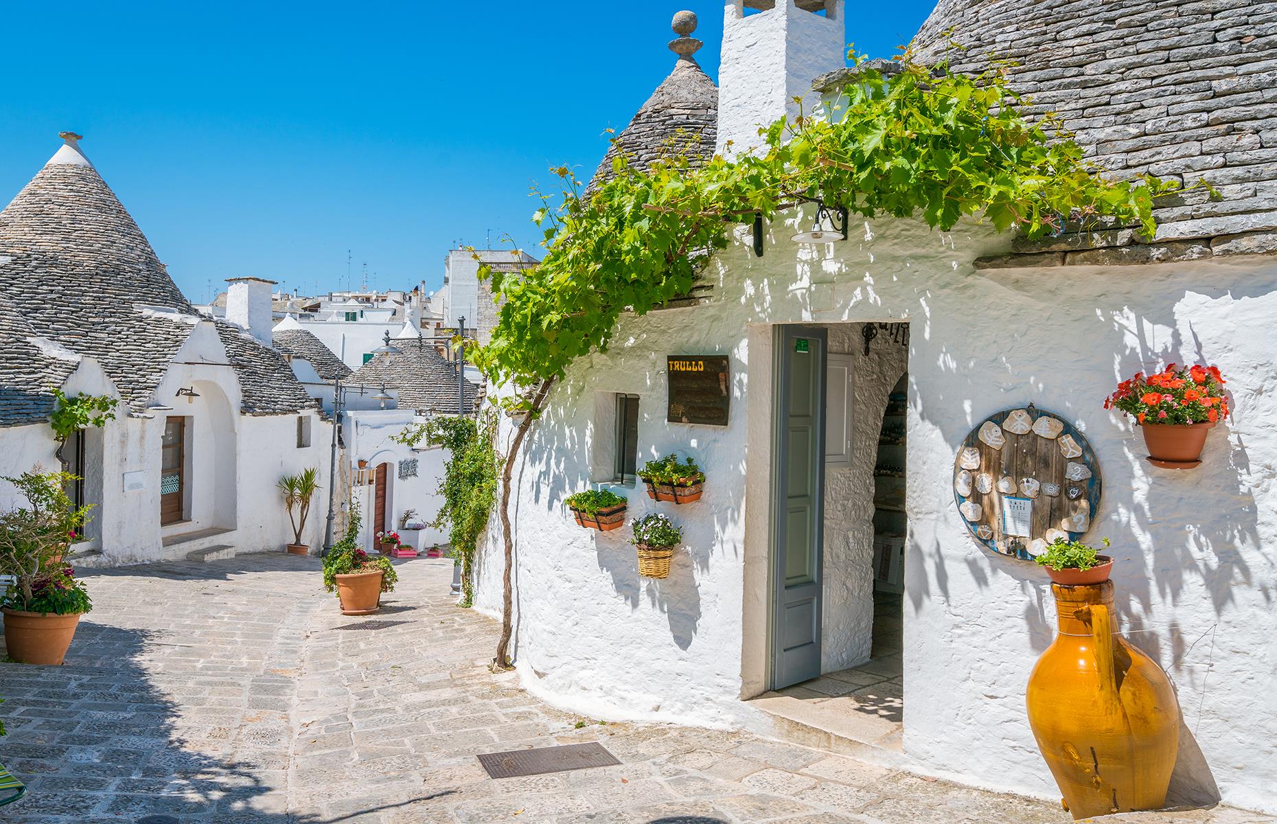 Slide 10 of 31: It's almost impossible not to find a picture-perfect street in Alberobello, a UNESCO World Heritage Site in its entirety. The small town in Italy's heel – Puglia – is famous for its unusual trulli houses, built from whitewashed local limestone, with conical roofs.