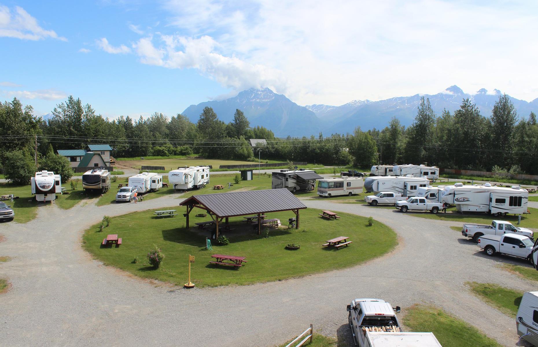 <p>Mountains loom over <a href="https://www.alaskarvpark.net/MonthlyGuests.html">this charming RV park</a>, which is dropped in the scenic Mat-Su Valley region of southern Alaska. Deluxe RV sites are available with full hook-up, fire rings and picnic tables, so guests can be completely self-sufficient (which the park advises at present). Nature is never far away here either: the park is flecked with native wildflowers and fir trees, and home to plenty of birdlife too. </p>