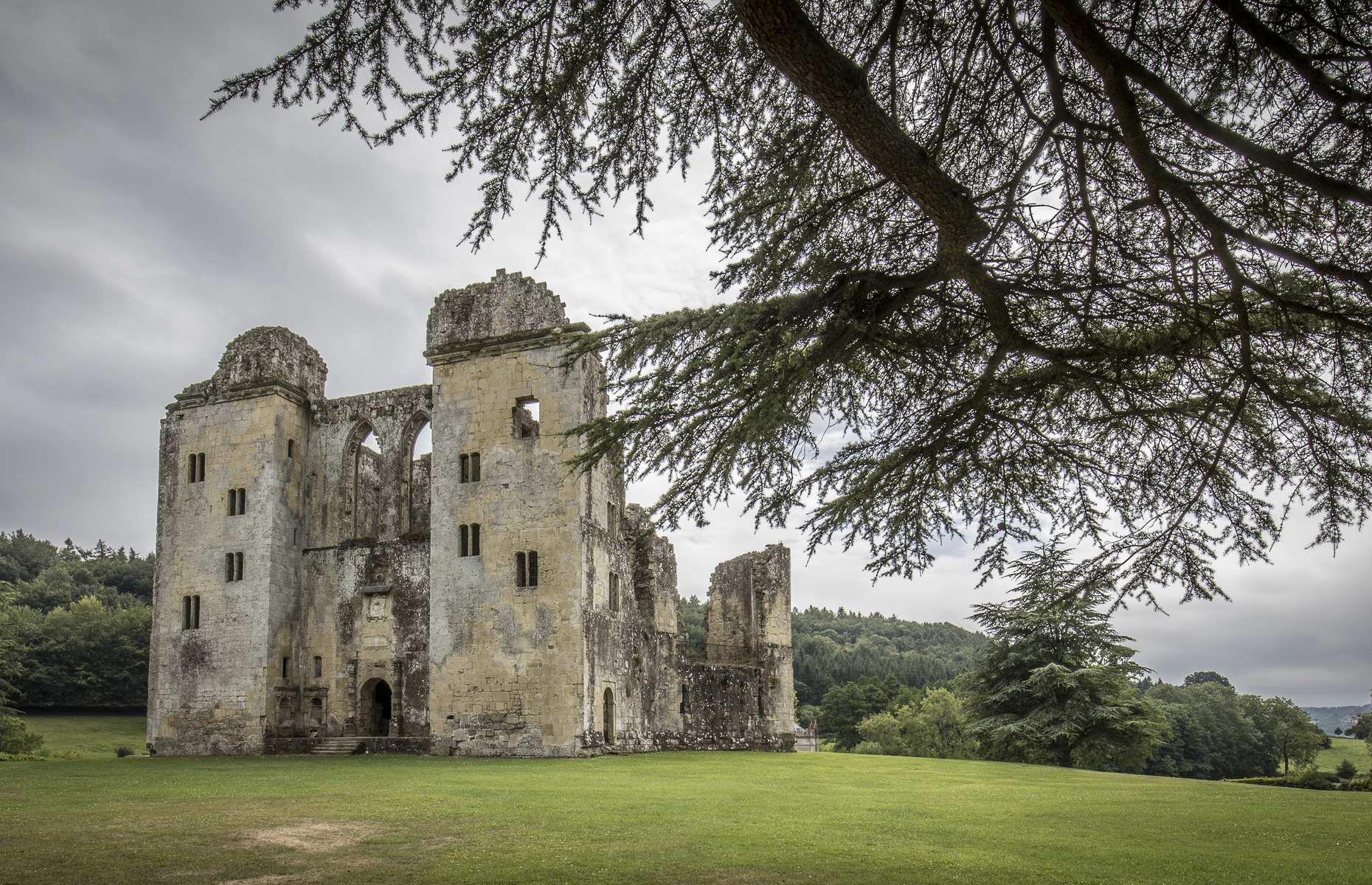 Slide 13 of 29: So deeply rooted is Old Wardour Castle in the English countryside that it seems to have always been in this crumbling state. But in the 14th century, here stood a magnificent French-style castle, built by John Lovell after marrying heiress Maud Holland.