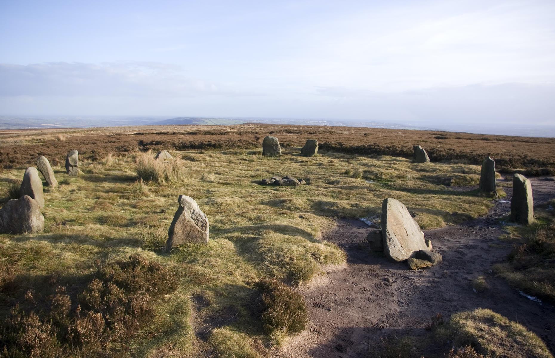 Slide 7 of 31: Amid the wild and bleak landscape of Burley Moor, part of the larger Rombald’s Moor, lies this intriguing Bronze Age formation. The so-called Twelve Apostles is a series of originally 16 to 20 stones which were likely placed here by ancient farmers. The West Yorkshire moorland, located near Ilkley, also has brooding rock formations, large burial cairns (a mound of stones erected over a burial) and notable Bronze Age rock carvings.
