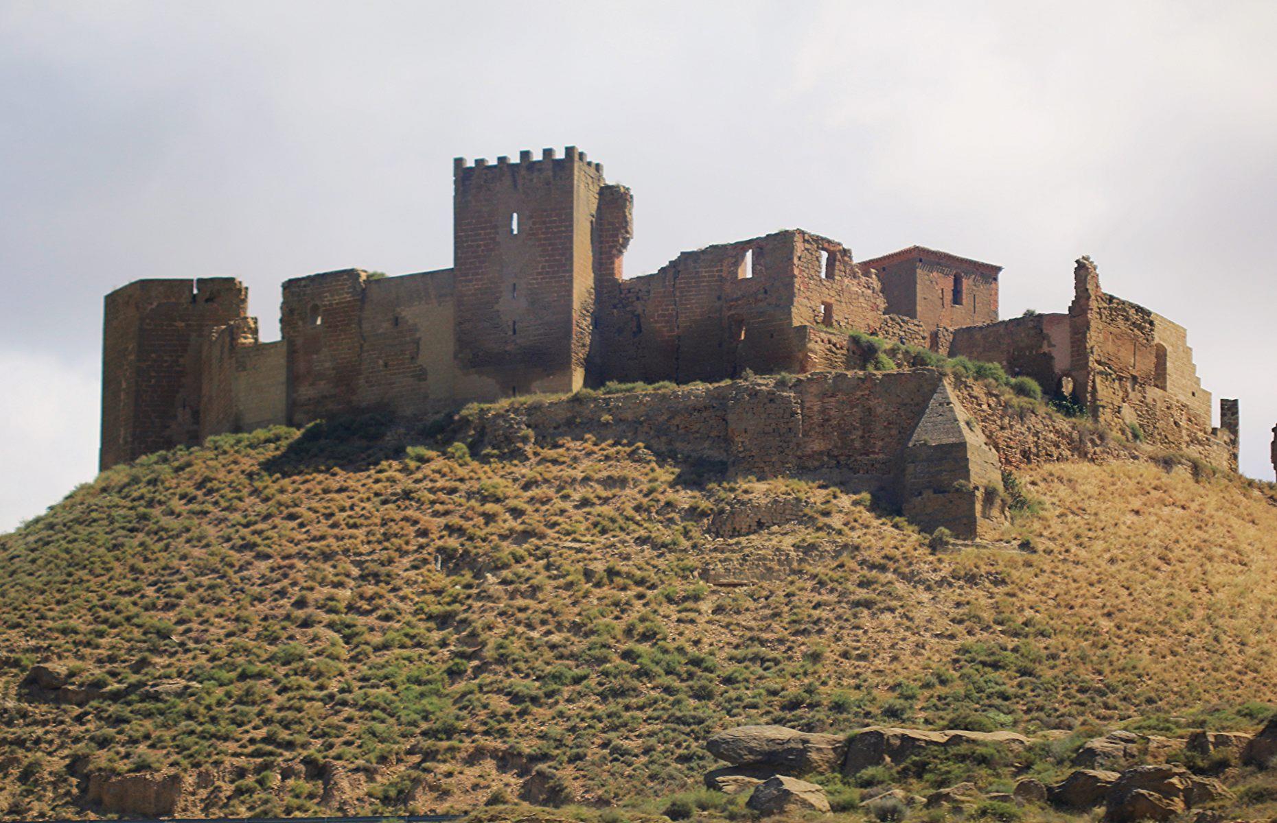 Slide 19 of 29: In the 19th century, the castle was used to store gunpowder and subsequently destroyed by an accidental explosion. It has laid in ruins ever since. With its crumbling walls and vacant chapel and bell tower, the castle casts a ghostly shadow over the whole region.