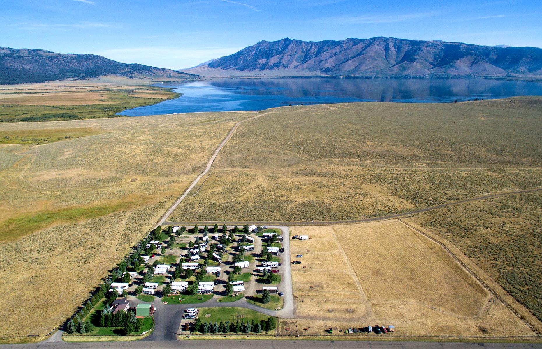 <p>With a name like "Red Rock", <a href="https://redrockrvpark.com/">this RV park</a> might sound like it belongs in America's southwest, but it's actually tucked away with the mountains and lakes of eastern Idaho. The park prides itself on its proximity to nature – it's 22 miles (35km) from the western entrance to Yellowstone (be sure to <a href="https://www.nps.gov/yell/index.htm">check the NPS site</a> for status updates if you're planning a visit) and vast Henry's Lake is right on the doorstep. It offers full hook-ups, plus private picnic tables and firepits too. </p>
