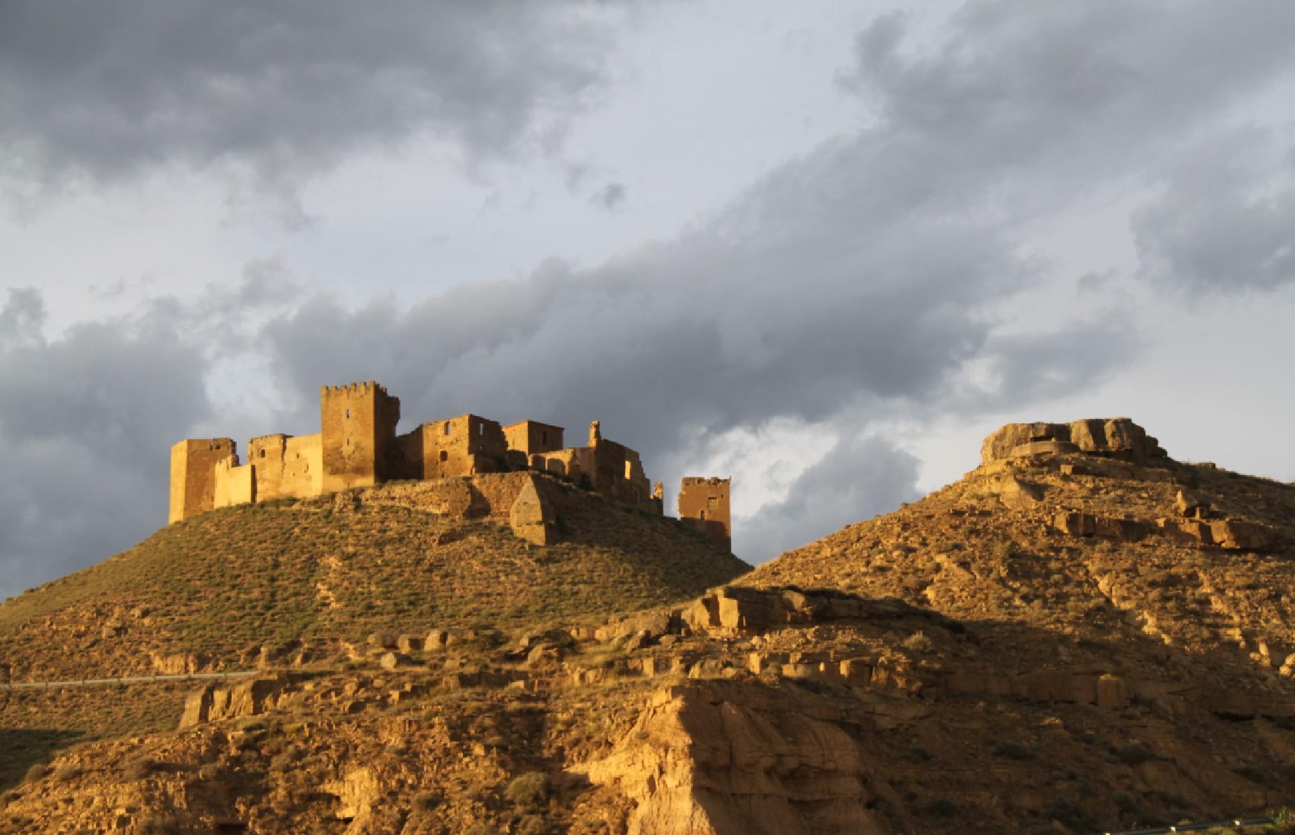 Slide 18 of 29: This 11th-century castle is visible for miles on its high vantage point overlooking the plains of Huesca, in Aragon, northern Spain. It was originally built to help conquer the then-Muslim area of Huesca but later was given over to Augustine monks who used it for seven centuries.