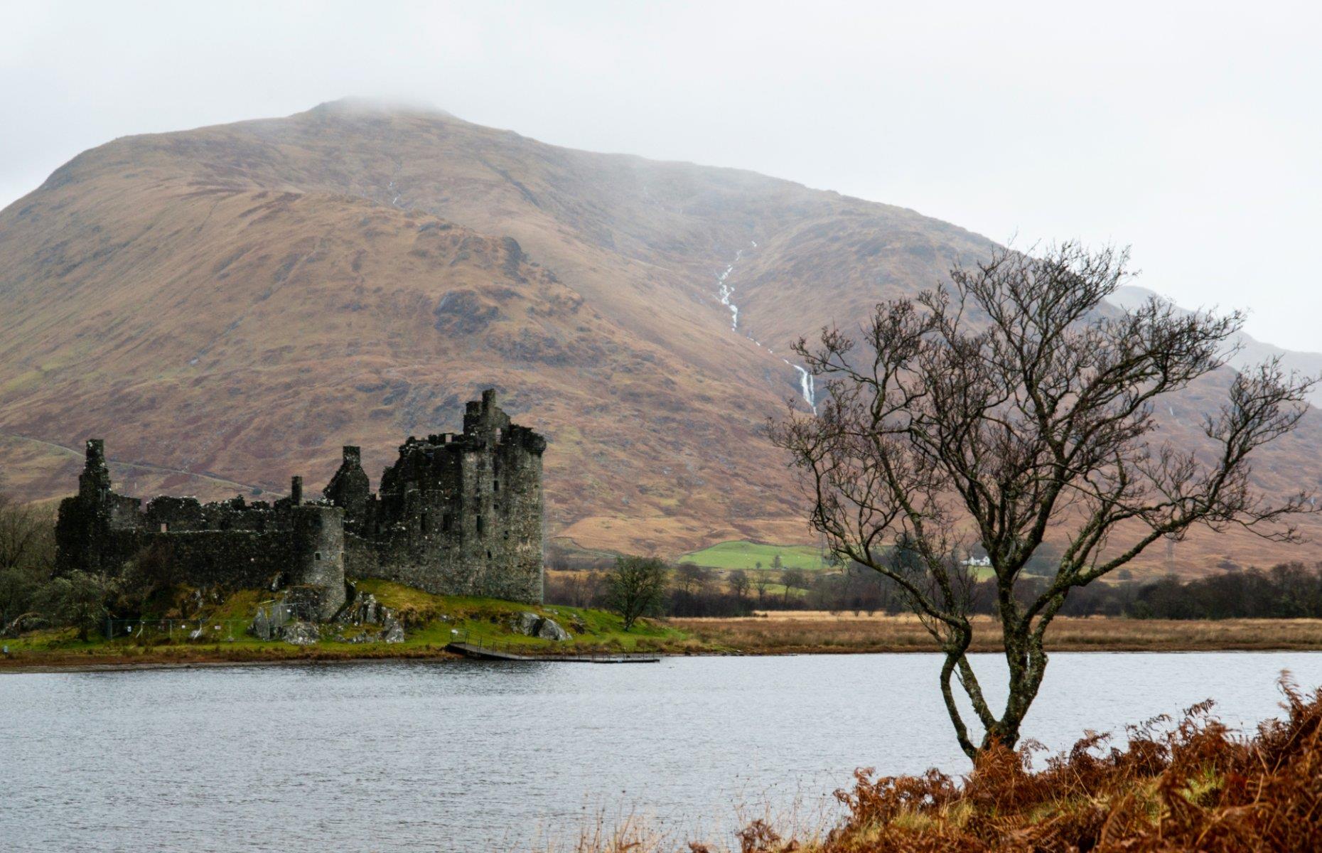 Slide 26 of 29: Back in the 13th century, Kilchurn Castle was a hub of energy. It was built in the mid-1400s by the Campbells of Glenorchy, a family who dominated the central Highlands. Originally it was constructed on an island not much bigger than the castle itself and was accessed by a causeway. During the Jacobite uprising of the late 1600s, the castle was converted into a garrison stronghold and at one time could hold 200 troops.