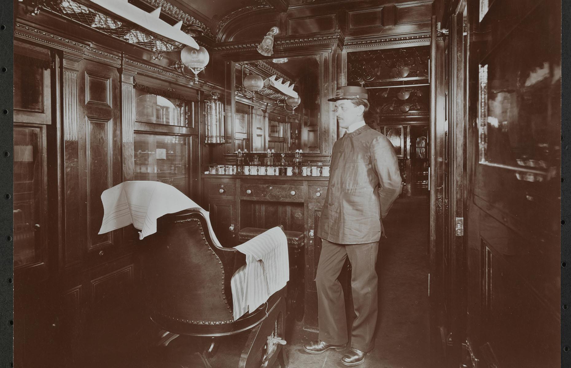 <p>As the wealthiest passengers' wants and needs grew larger, trains became even more luxurious, turning into 5-star hotels, restaurants and salons on wheels. This barber operated a shop aboard a train of the Erie Railroad, connecting New York City and Jersey City with Cleveland, Buffalo and Chicago.</p>
