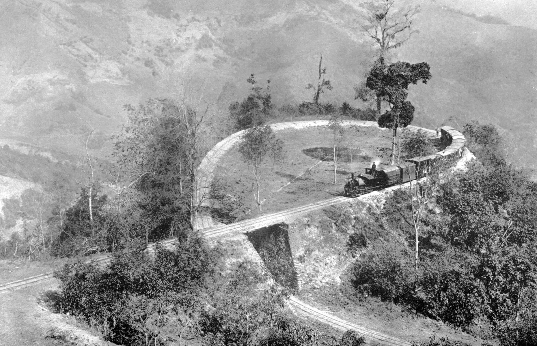 A UNESCO World Heritage Site, the Darjeeling Himalayan Railway is undoubtedly one of the world's most famous trains. Built between 1879 and 1881, the line is about 55 miles (89km) long and uses six zig-zags and five loops to gain an altitude of just under 7,000 feet (2,134m). One such loop is loop No.4 or Agony Point loop, photographed here in around 1910.