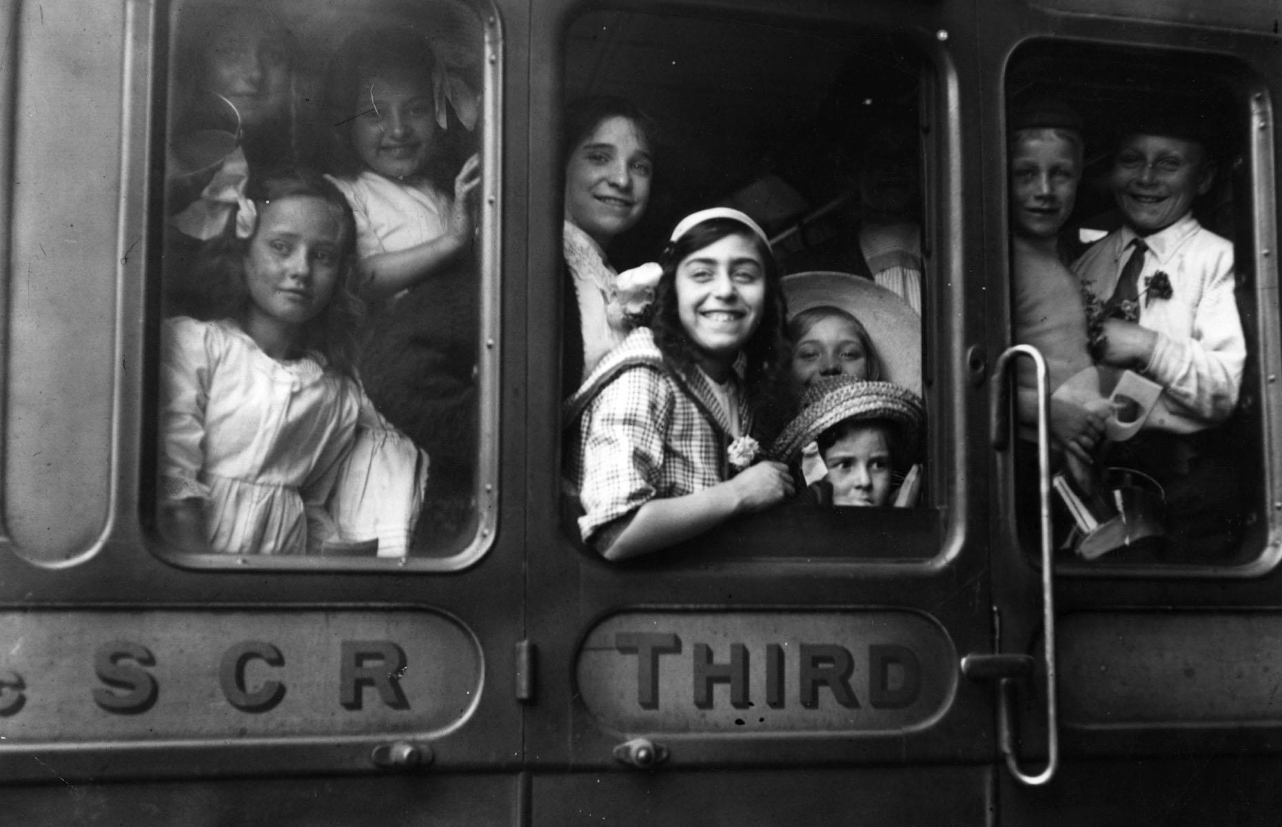 <p>As trains grew more and more popular around the world, plenty of people were keen to enjoy this speedier way of travel. Obviously, third class comfort was nowhere near the service first class passengers enjoyed. Yet these children and young adults are still excited for their vacation trip to Bognor Regis on the south coast of England, photographed before leaving London Bridge station in July 1913.</p>