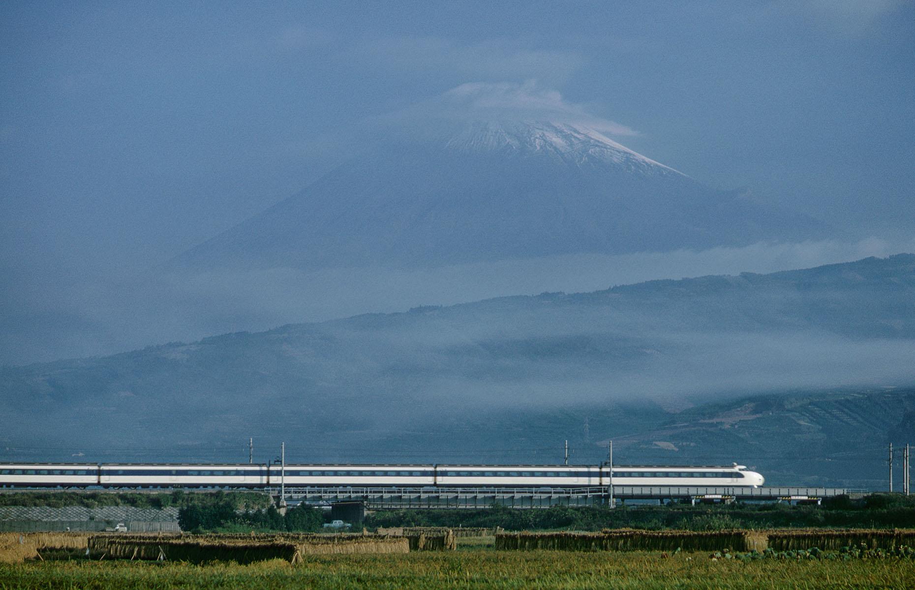 A huge advancement in modern day rail travel, Japan's new high-speed Shinkansen trains shortened the travel time between Tokyo and Osaka by three hours and 10 minutes. Launched in 1964, just in time for the first Tokyo Olympics, the new bullet trains quickly grew in both popularity and size. Here, a bullet train travels on the first Shinkansen Tokaido Line with Mount Fuji in the background in 1968.