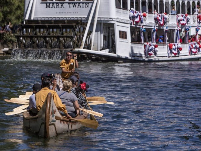 Slide 4 of 23: On Davy Crockett's Explorer Canoes, guests have to work for their fun. Although the cast members on board are able to row and steer the canoes on their own, riders can help them make their way around the Rivers of America.